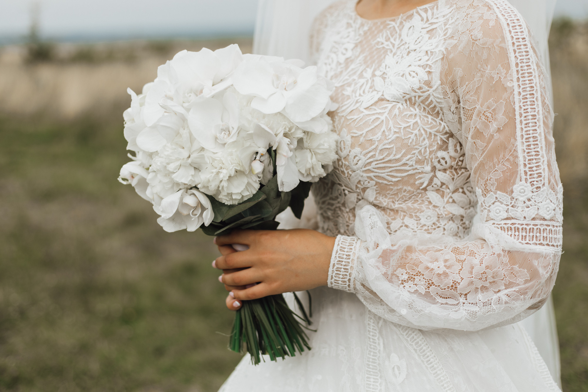wedding-bouquet-made-white-peonies-bride-s-hand-outdoors